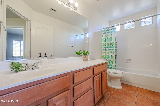 full bathroom with tile patterned flooring, shower / bath combo, vanity, and toilet