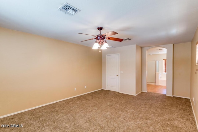 carpeted spare room with ceiling fan