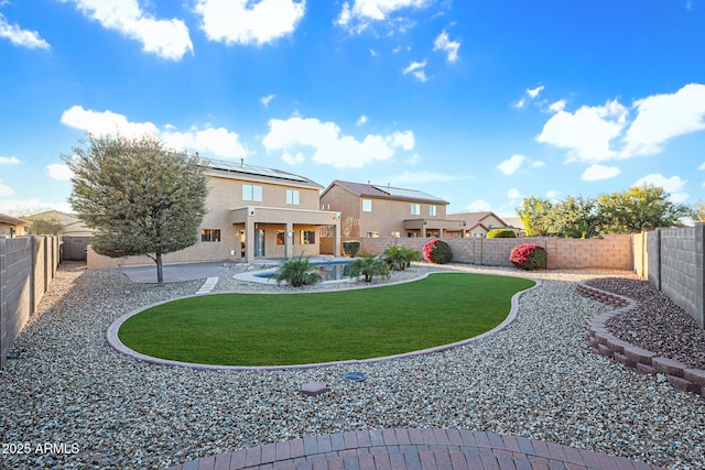 rear view of house with a patio and a lawn