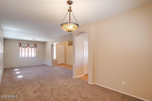 unfurnished room with light colored carpet