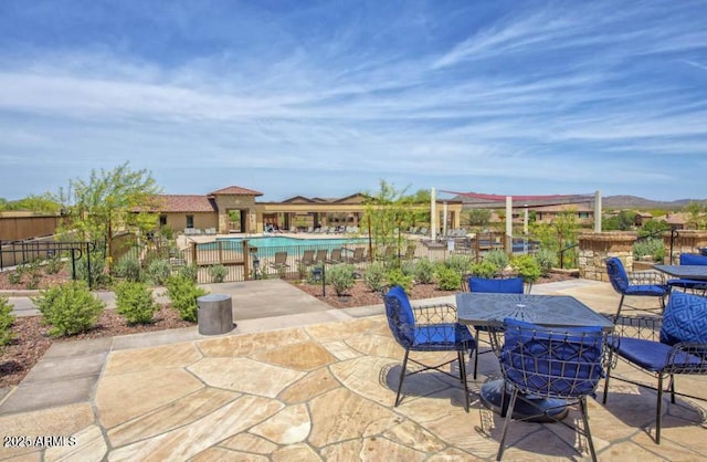 view of patio / terrace featuring a community pool