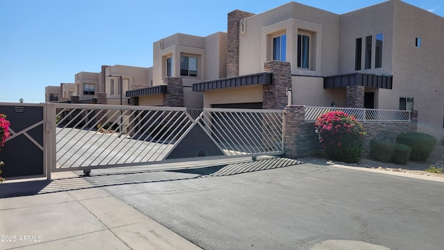 view of gate with fence