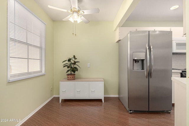 kitchen featuring white cabinetry, stainless steel fridge, ceiling fan, and dark hardwood / wood-style floors