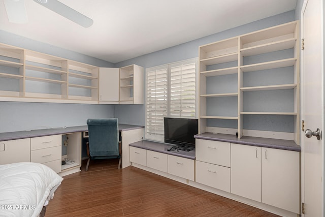 unfurnished bedroom with ceiling fan and dark hardwood / wood-style flooring