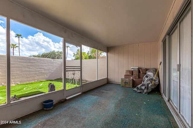 unfurnished sunroom featuring a wealth of natural light