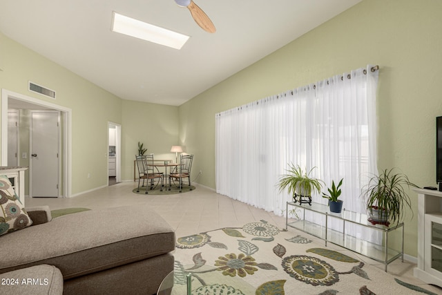 living room featuring ceiling fan and light tile patterned flooring