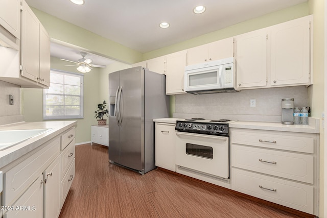 kitchen with stainless steel refrigerator with ice dispenser, stove, white cabinetry, and ceiling fan