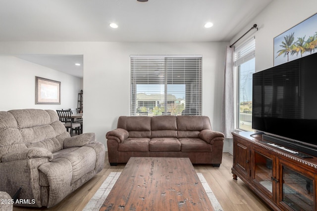 living room with light hardwood / wood-style flooring