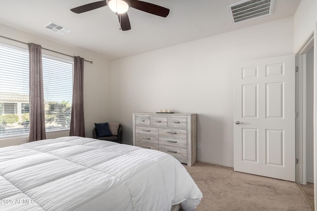 bedroom with light colored carpet and ceiling fan