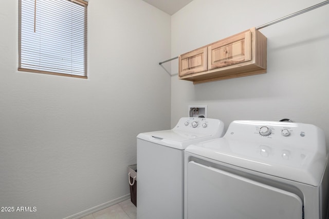 washroom featuring separate washer and dryer and light tile patterned floors