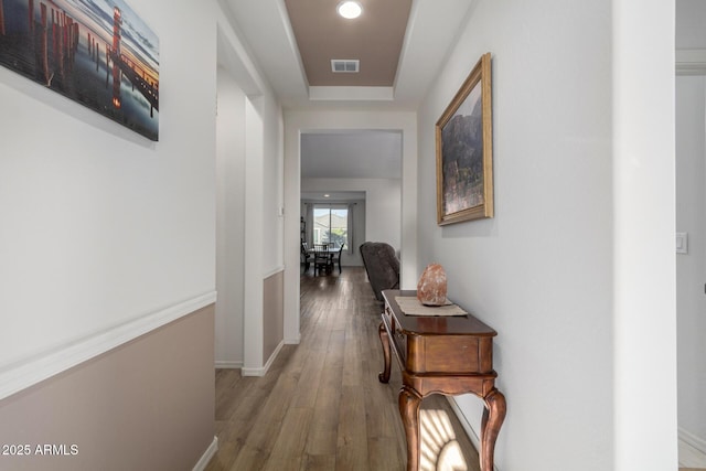 corridor with wood-type flooring