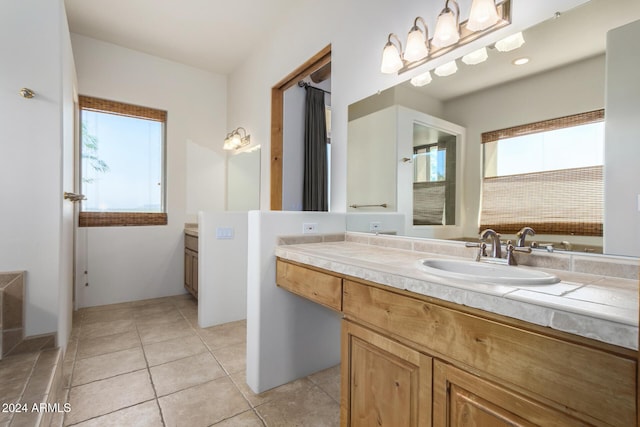 bathroom with tile patterned flooring and vanity