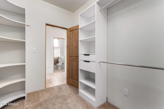 spacious closet featuring light tile patterned flooring