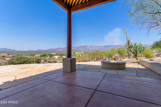 view of patio with a mountain view