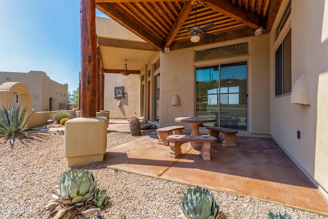 view of patio featuring ceiling fan