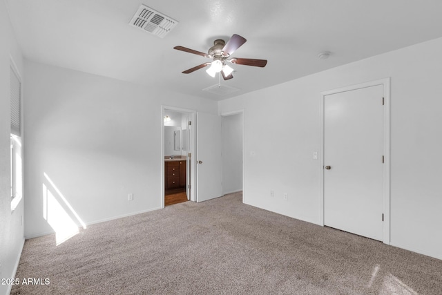 unfurnished bedroom with ceiling fan, carpet, visible vents, and connected bathroom