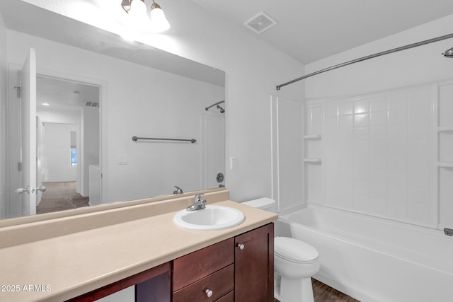 bathroom featuring shower / bathtub combination, vanity, visible vents, and toilet