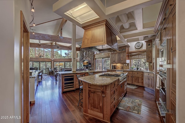 kitchen featuring dark wood-style floors, wine cooler, beam ceiling, stainless steel appliances, and tasteful backsplash