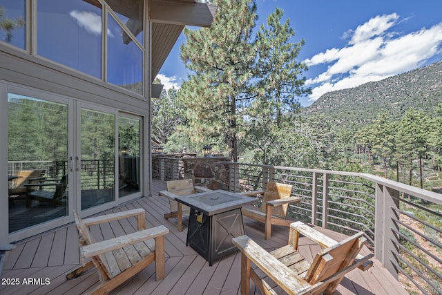 deck featuring a fire pit