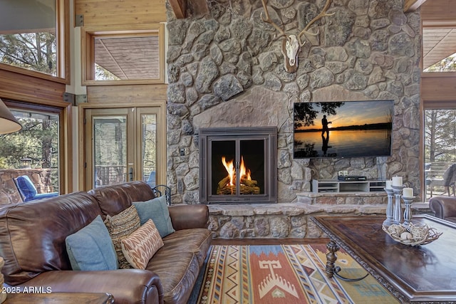 living area featuring a stone fireplace