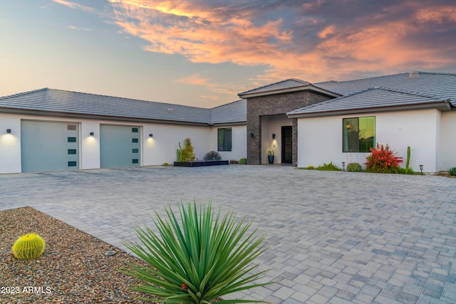 prairie-style house featuring a garage