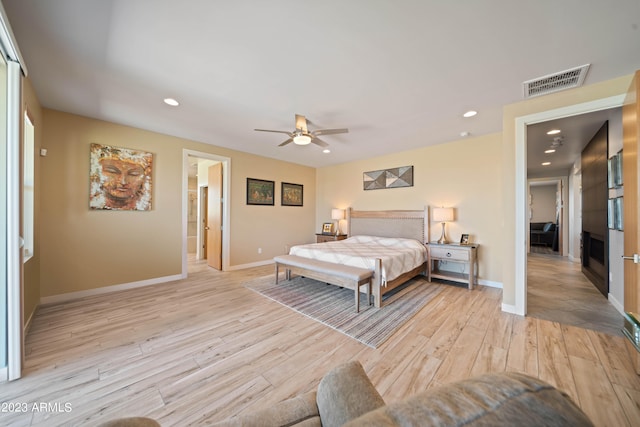 bedroom featuring light hardwood / wood-style floors and ceiling fan