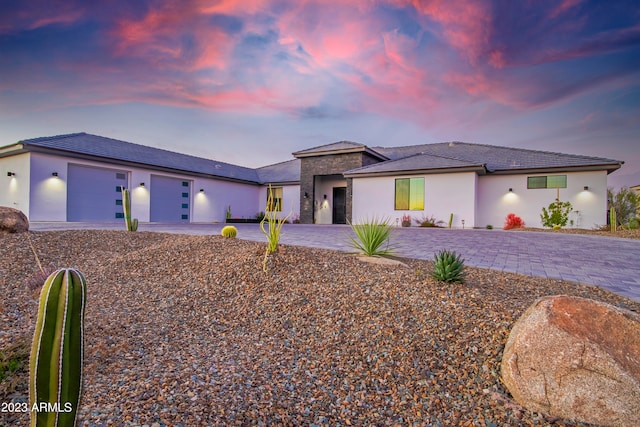 prairie-style house featuring a garage