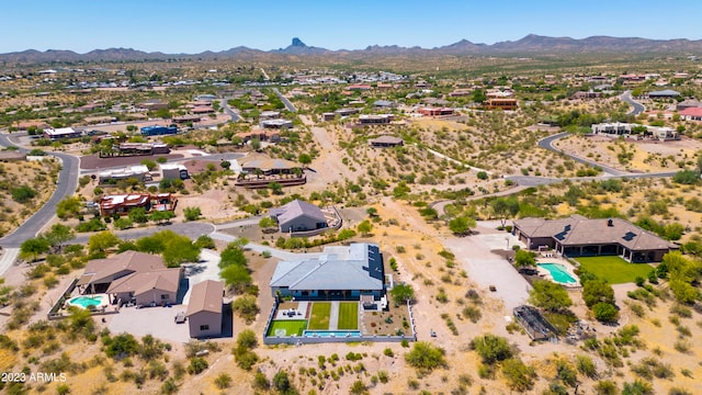 birds eye view of property featuring a mountain view