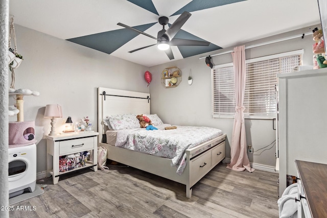 bedroom featuring ceiling fan and light wood-type flooring