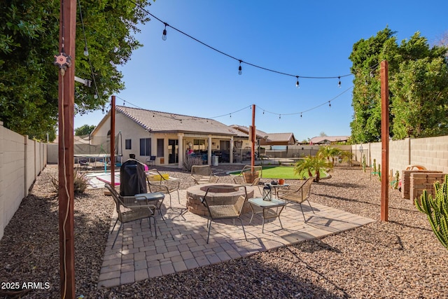 view of patio featuring an outdoor fire pit