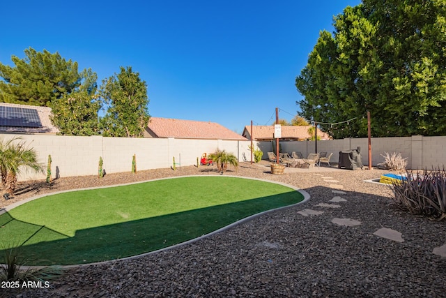 view of yard featuring a patio and a fire pit