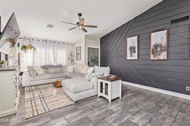 living room with lofted ceiling and ceiling fan