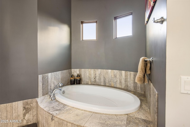 bathroom with tiled tub