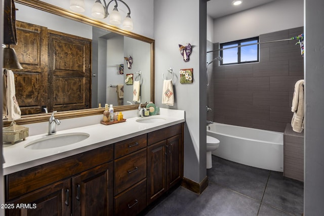 full bathroom featuring tile patterned floors, vanity, toilet, and tiled shower / bath combo