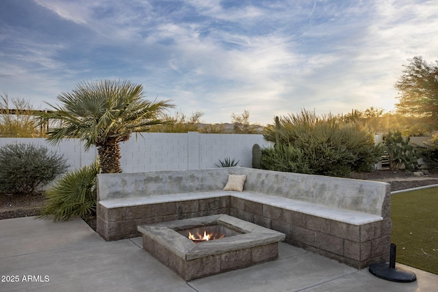 view of patio with an outdoor fire pit