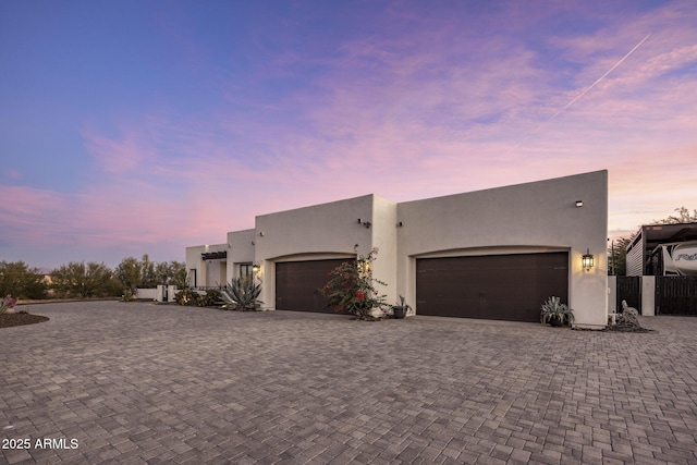 southwest-style home featuring a garage