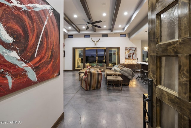 living room with beamed ceiling and ceiling fan