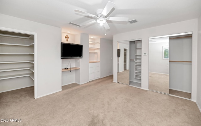 5787 W Barbara Ave, Glendale, AZ 85302 - unfurnished bedroom featuring carpet floors, multiple closets, baseboards, and ceiling fan