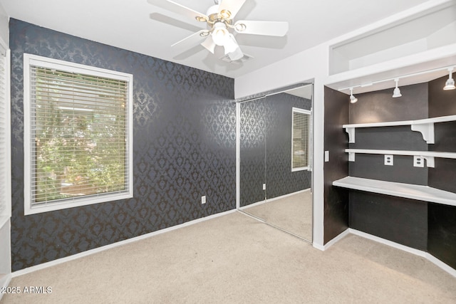 5787 W Barbara Ave, Glendale, AZ 85302 - unfurnished bedroom with wallpapered walls, carpet flooring, ceiling fan, and baseboards