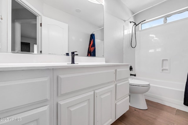 5787 W Barbara Ave, Glendale, AZ 85302 - bathroom featuring toilet, tub / shower combination, vanity, and wood finished floors