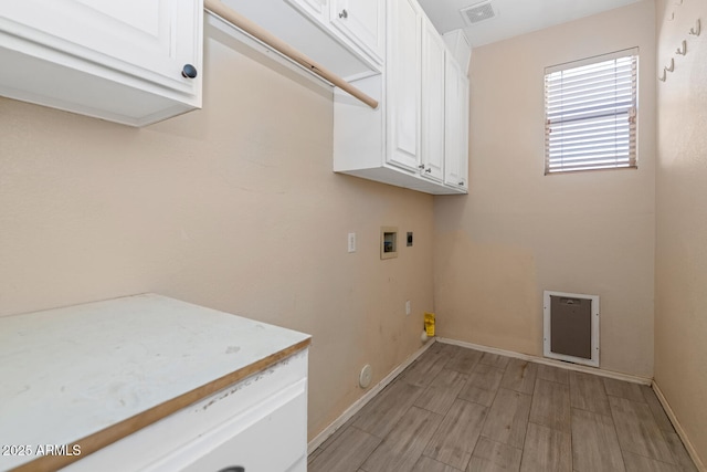 5787 W Barbara Ave, Glendale, AZ 85302 - laundry area with cabinet space, washer hookup, baseboards, light wood-style floors, and heating unit
