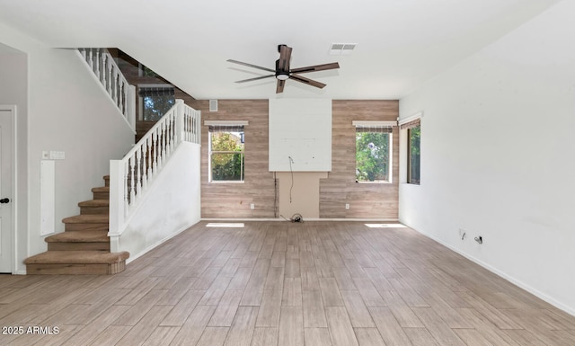 5787 W Barbara Ave, Glendale, AZ 85302 - unfurnished living room with stairs, a ceiling fan, wood finished floors, and baseboards