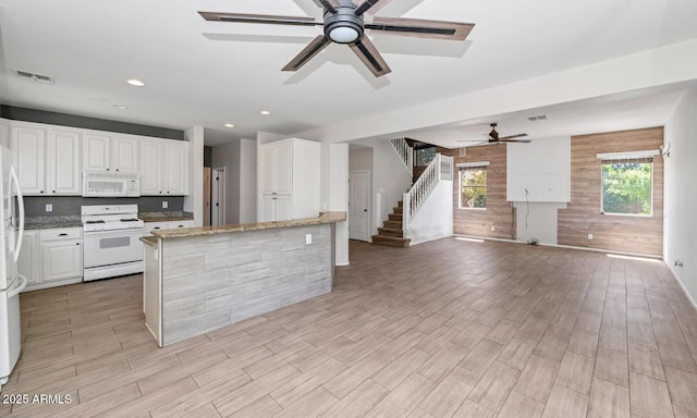5787 W Barbara Ave, Glendale, AZ 85302 - kitchen with white appliances, a ceiling fan, open floor plan, white cabinets, and light wood-type flooring