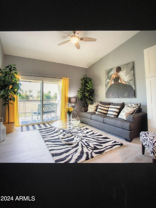 tiled living room with ceiling fan