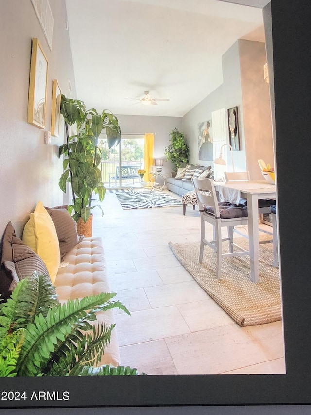 interior space with ceiling fan