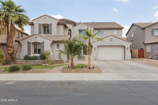 11142 E Ravenna Ave, Mesa, AZ 85212 - mediterranean / spanish home with a tiled roof, stucco siding, concrete driveway, and an attached garage