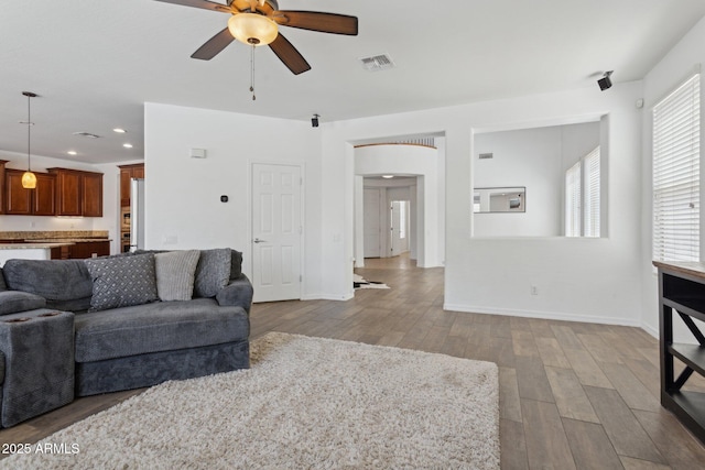11142 E Ravenna Ave, Mesa, AZ 85212 - living room with ceiling fan, wood finished floors, recessed lighting, and baseboards