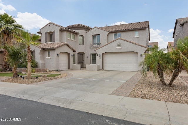 11142 E Ravenna Ave, Mesa, AZ 85212 - mediterranean / spanish house featuring a tile roof, concrete driveway, stucco siding, and a garage