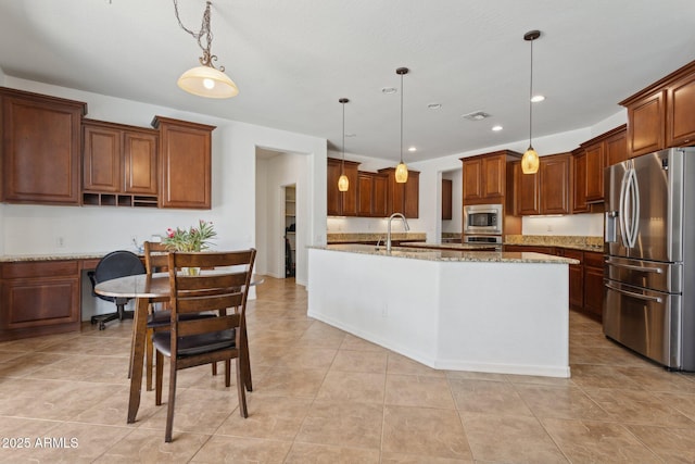 11142 E Ravenna Ave, Mesa, AZ 85212 - kitchen featuring stainless steel appliances, decorative light fixtures, light stone countertops, recessed lighting, and a center island with sink