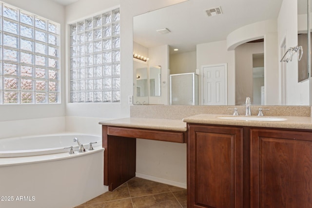 11142 E Ravenna Ave, Mesa, AZ 85212 - bathroom featuring vanity, a stall shower, a garden tub, tile patterned floors, and healthy amount of natural light